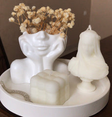 veiled woman statue candle